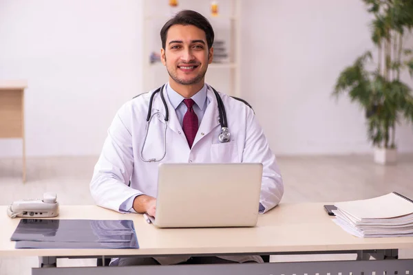 depositphotos 462364634 stock photo young male doctor working in